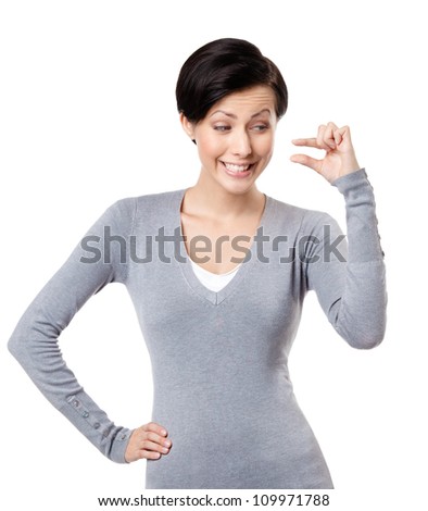 Mocking woman gestures small amount, isolated on white