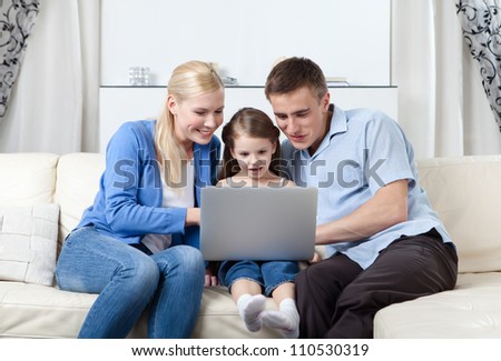 Happy family surf on the internet