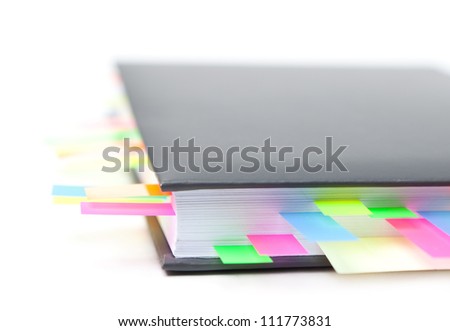 Business diary with a colored tabs, isolated on white background