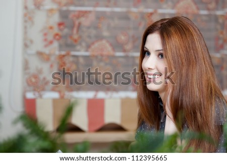 Woman speaks on the mobile phone at the restaurant