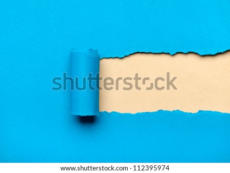 Torn light blue paper with milky copyspace for your message. Paper roll