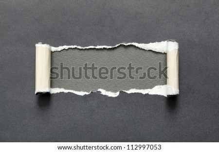 Torn black paper with grey space for your message