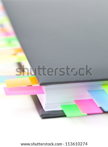 Diary with a colored tabs, isolated on white background