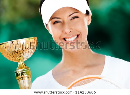 Professional tennis player won the cup at the sport competition. Victory