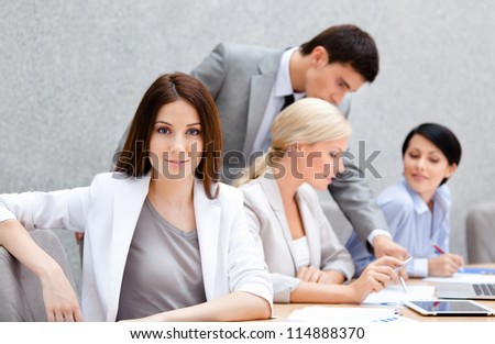 Business people at the meeting discuss current issues at the modern office building