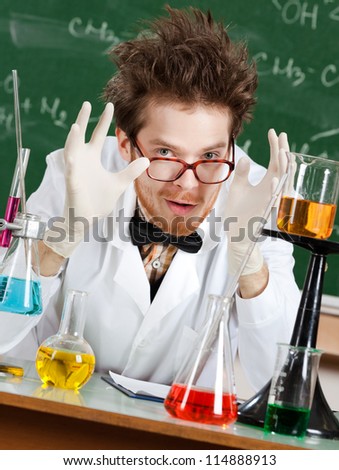 Gesturing a great amount mad professor is in his laboratory