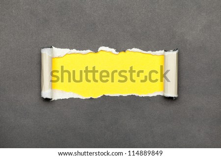 Torn curled paper with yellow space for your message