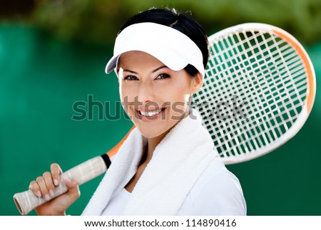 Close up of tennis player with towel on her shoulders