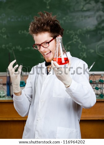 Mad professor is happy with experiment results in his laboratory