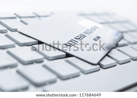 Close up of credit card on a computer keyboard. Concept of internet shopping