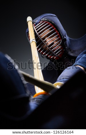 Close up shot of competition of two kendo fighters. Japanese martial art of sword fighting