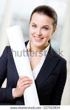Female engineer wearing suit hands layout