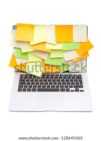 Laptop covered with colored stickers, isolated on white