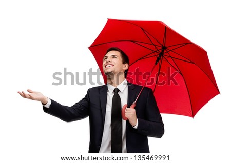 Palming up man with umbrella checks the rain, isolated on white