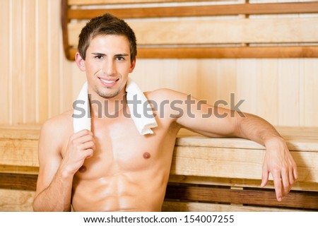 Naked man relaxing in sauna. Concept of self-care, health and relaxation
