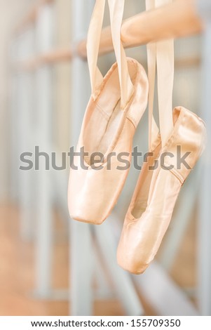 Close Up Of Pointes For Ballet On Barre Near The Mirrors In Classroom