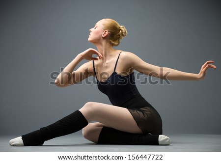 Dancing on the floor ballerina, isolated on grey. Concept of elegant art and sportive hobby