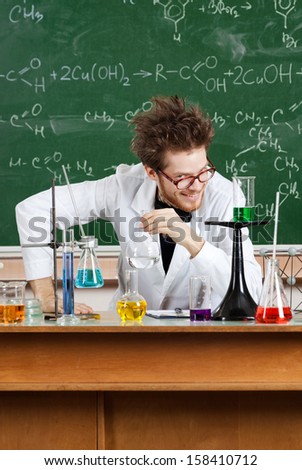 Mad professor laughs in his laboratory