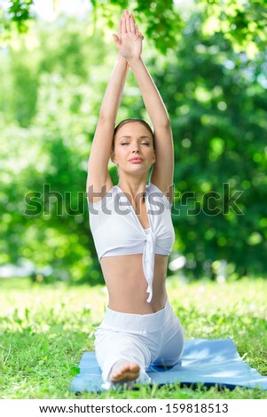 Woman with closed eyes does the splits. Concept of healthy lifestyle and fitness