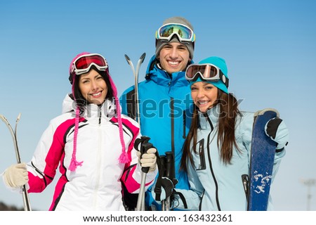 Half-length portrait of group of skier friends. Concept of cute winter sport and funny vacations with friends