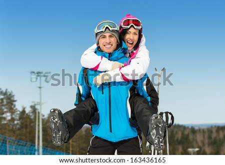 Half-Length Portrait Of Happy Couple Of Skiers Have Fun. Concept Of Winter Sports And Cute Vacations