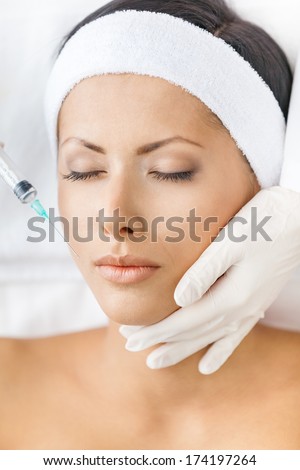 Headshot Of Woman Getting Injections On Face. Concept Of Plastic Surgery And Beauty