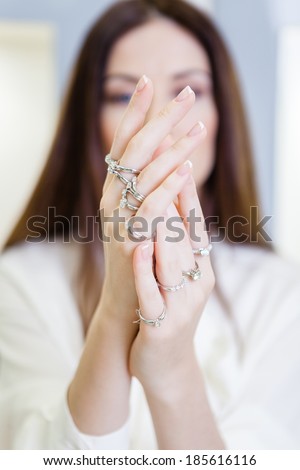 Close up view of female hands with rings. Concept of wealth and luxurious life