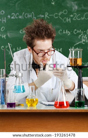 Mad professor thinks about the result of the experiment in his laboratory