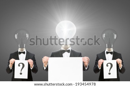Half-length portrait of three businessmen with bulbs instead of heads keeping question marks and copyspace for solution, isolated on grey