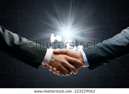 Close up of handshake of business people against world connection background. Concept of trustworthy relations and business cooperation
