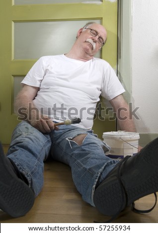 Exhausted house painter takes a break