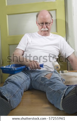 Exhausted house painter takes a break