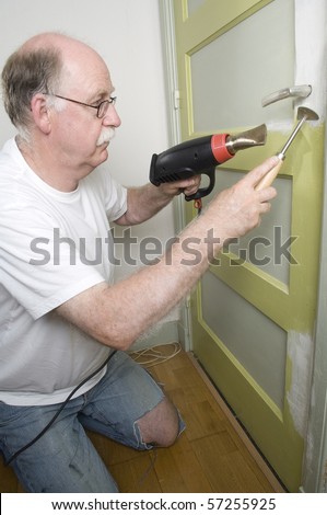 Tool man using paint remover