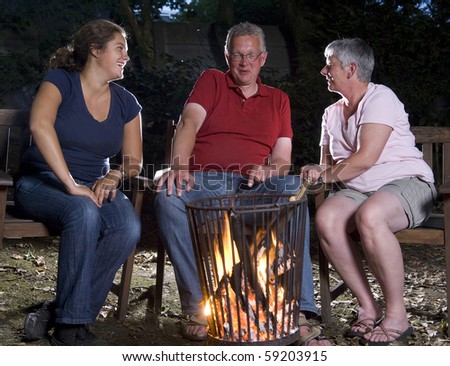 Family at campfire in the garden