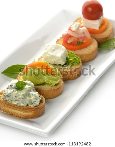Toasted Bread Slices With Spinach Dip,Avocado,Cheese And Tomatoes