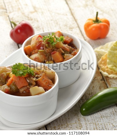 Bowls Of Vegetable Soup On Wooden Table