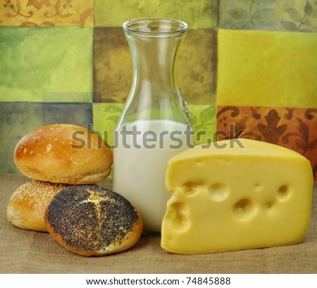 Dairy products arrangement - milk , cheese and bread rolls
