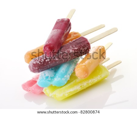 a stack of colorful ice cream pops