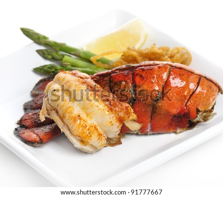 Grilled Lobster Tail Served With Asparagus And Onion