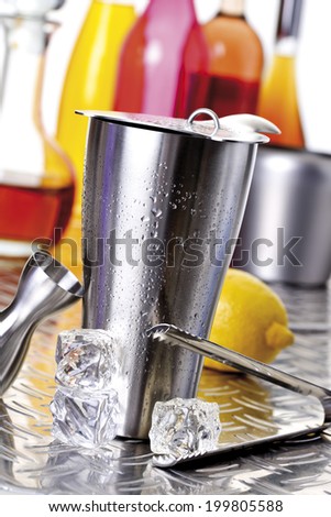 Cocktail shaker with drops of water, bar utensils