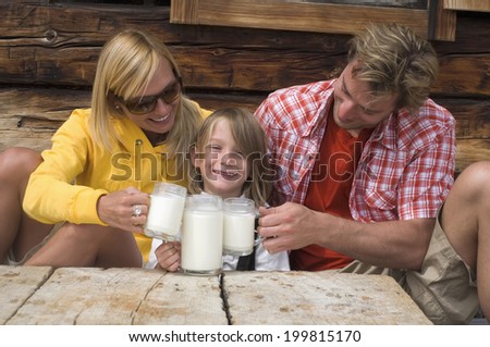 Austria, Salzburger Land, Family drinking milk