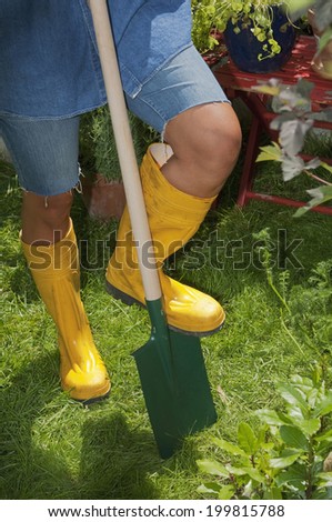 Austria, Salzburger Land, Person with spade, gardening