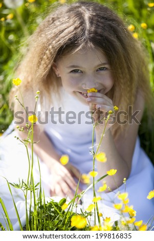 Germany, Bavaria, Girl smelling flowers, portrait