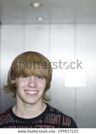Boy (16-17) in lift, portrait