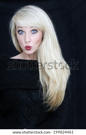 Young woman pursing lips, portrait