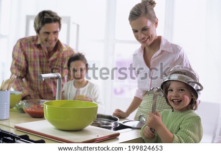 Family cooking spaghetti