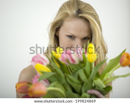 Woman holding bunch of flowers