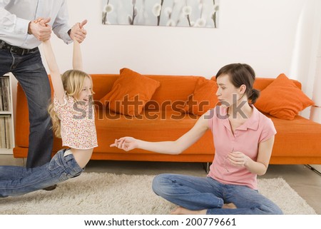 Playful family in living room