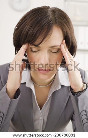 Businesswoman tired with working hands on head