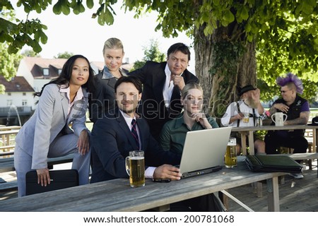 Germany, Bavaria, Upper Bavaria young business people in beer garden